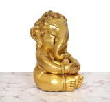 Brass Bal Ganesha murti, seated side angle, clasped legs and bangled hands
