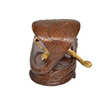 Brass Vishnu yoga nidra idol, back view with textured cobra hood and raised arm