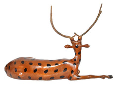 Brass sitting deer showpiece, side profile showing smooth spotted coat and antlered head