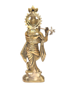Rear view of brass Lord Krishna figurine holding a flute, ornate crown details