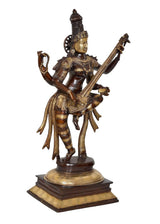 Brass Saraswati statue playing sitar, front angled view, crown and ornamented attire