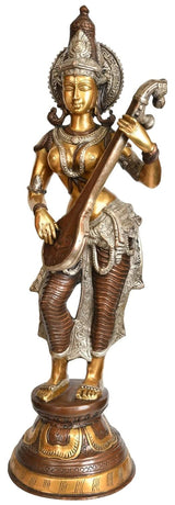 Standing Saraswati brass idol holding veena, detailed face, crown, and ornaments