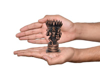 Hand-held scale photo of Lakshmi Varaha copper statue with multi-hood cobra canopy