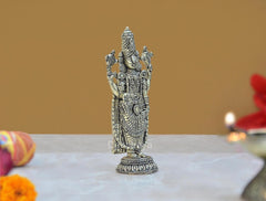 Brass Lord Balaji idol statue, angled view with patterned clothing and crown details