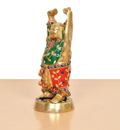 Brass laughing Buddha statue side view, gold base, raised arms and smiling face