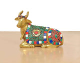 Brass Nandi figurine facing left, detailed jeweled blanket in red, green, blue