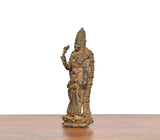 Copper Meenakshi idol, three-quarter side view with raised hand and headdress