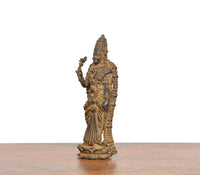 Copper Meenakshi idol, three-quarter side view with raised hand and headdress