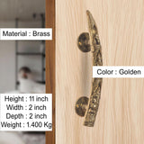 Golden brass Ganesha door handle pair on light wood door, round rosettes, 11 in height