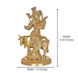 Brass khaniya statue on base; height 9.25 in, width 7.5 in, cow flute player