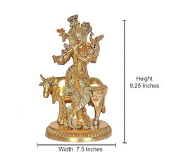 Brass khaniya statue on base; height 9.25 in, width 7.5 in, cow flute player