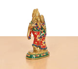 Radha-Krishna brass idol rear/side view, red outfit with gold detailing, multicolor beads