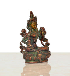 Brass Tara Devi statue, three-quarter view, seated goddess with ornate crown on base