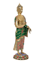 Standing Buddha statue, brass gold face, green robe with red and yellow motifs, folded hands
