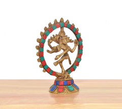 Brass Natraj Lord Shiva dancing idol from angle, multicolor halo and gold figure