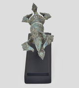Bronze Dorje figurine on black wooden base, turquoise patina, side view