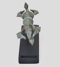 Bronze Dorje figurine on black wooden base, turquoise patina, side view