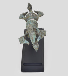 Bronze Dorje figurine on black wooden base, turquoise patina, side view