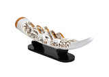 Side view of resin seven running horse tusk showpiece with textured details, on black base.
