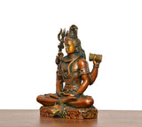 Superfine Brass Lord Shiva statue in side view, trident raised and drum held at right