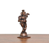 Copper dancing Bal Krishna figure holding laddu, back angle on square base