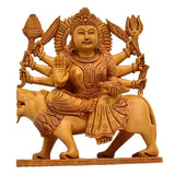 Handcarved wooden Durga figurine on lion, four arms, ornate crown, decorative showpiece