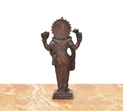 Brown brass Dhanvantri statue (6 inches), back/rear view with raised arms and crown