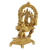 Angled view brass Garuda Bhagwan murti with seated figure at base, 7 inch