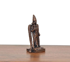Copper Madurai Meenakshi idol, side view with detailed standing garments on base