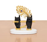 Black resin Krishna hands with flute, gold peacock hood, blue-eyed face, white base