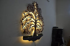 LED lit iron tree wall art with warm glow, pink leaf clusters, and blue hanging base
