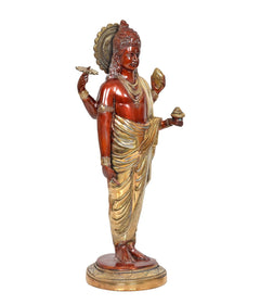 Dhanvantri brass statue three-quarter view, red deity body, gold draped robe, round base