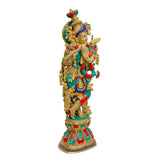 Krishna murti in brass, standing posture, teal garment with red and blue accents