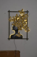 Gold butterfly-hair woman wall decor in rectangular frame with power cord