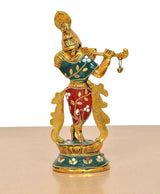 Krishna metal sculpture front-left view, gold body with red ornaments and teal base patterns