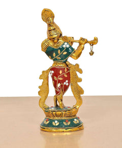 Krishna metal sculpture front-left view, gold body with red ornaments and teal base patterns
