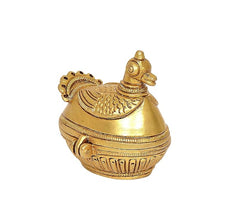 Brass peacock-shaped sindoor box with patterned sides and lid finial