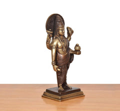 Brass Dhanvantri statue angled view, halo, holding a small pot-like object