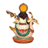 Resin Saraswati idol from behind, decorated crown and draped back, veena