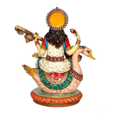 Resin Saraswati idol from behind, decorated crown and draped back, veena
