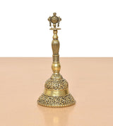 Bronze pooja bell ghanti standing with carved base and Sudarshan Chakra top