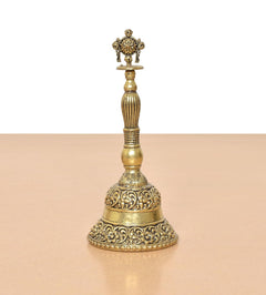 Bronze pooja bell ghanti standing with carved base and Sudarshan Chakra top