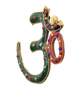 Multicolor OM wall hanging, angled view with green enamel and red-blue ring