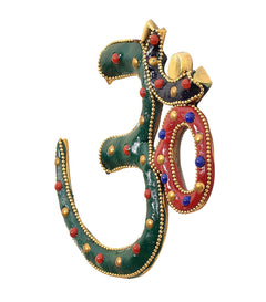 Multicolor OM wall hanging, angled view with green enamel and red-blue ring