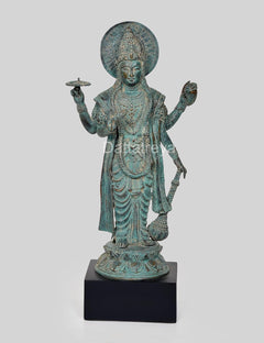 Bronze Vishnu statue on base, detailed draped garment, round halo, raised right hand