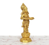Golden brass Apsara lady holding an oil lamp, 3/4 angle figurine