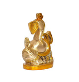 Brass Ganesha figurine side view, ornate ear and trunk, gold base