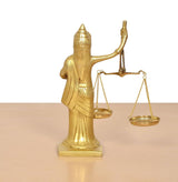 Lady Justice statue with scales, gold tone; arms holding balance beam, draped robe