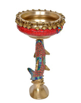 Standing brass urli bowl candle lamp on fish figure base, red and blue details