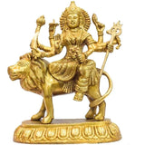 Maa Durga golden brass statue on lion, four arms holding symbols